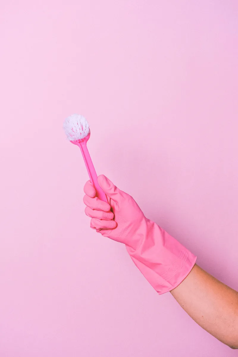 pink gloves and brush